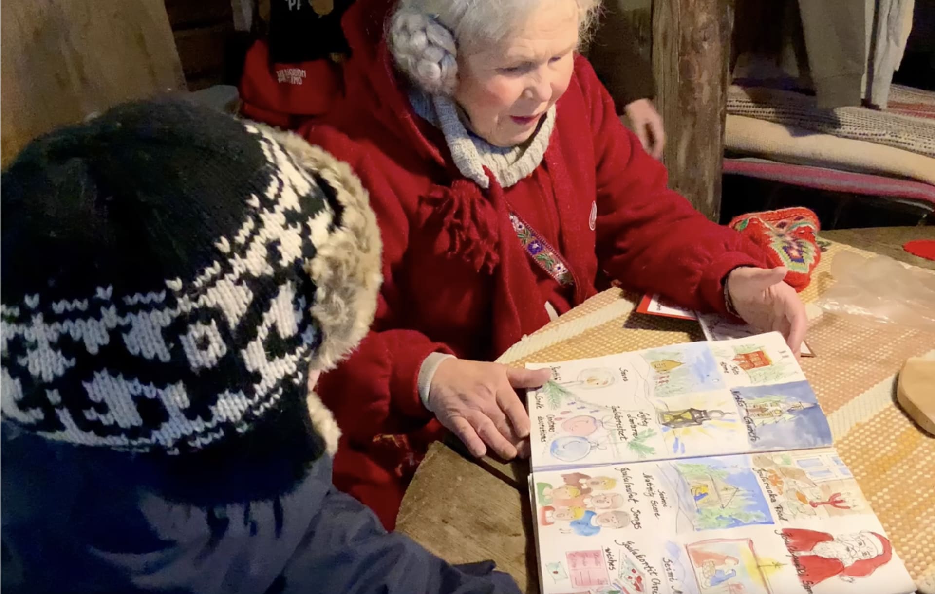 Mrs. Santa Claus Finland telling a child about the Finnish Christmas