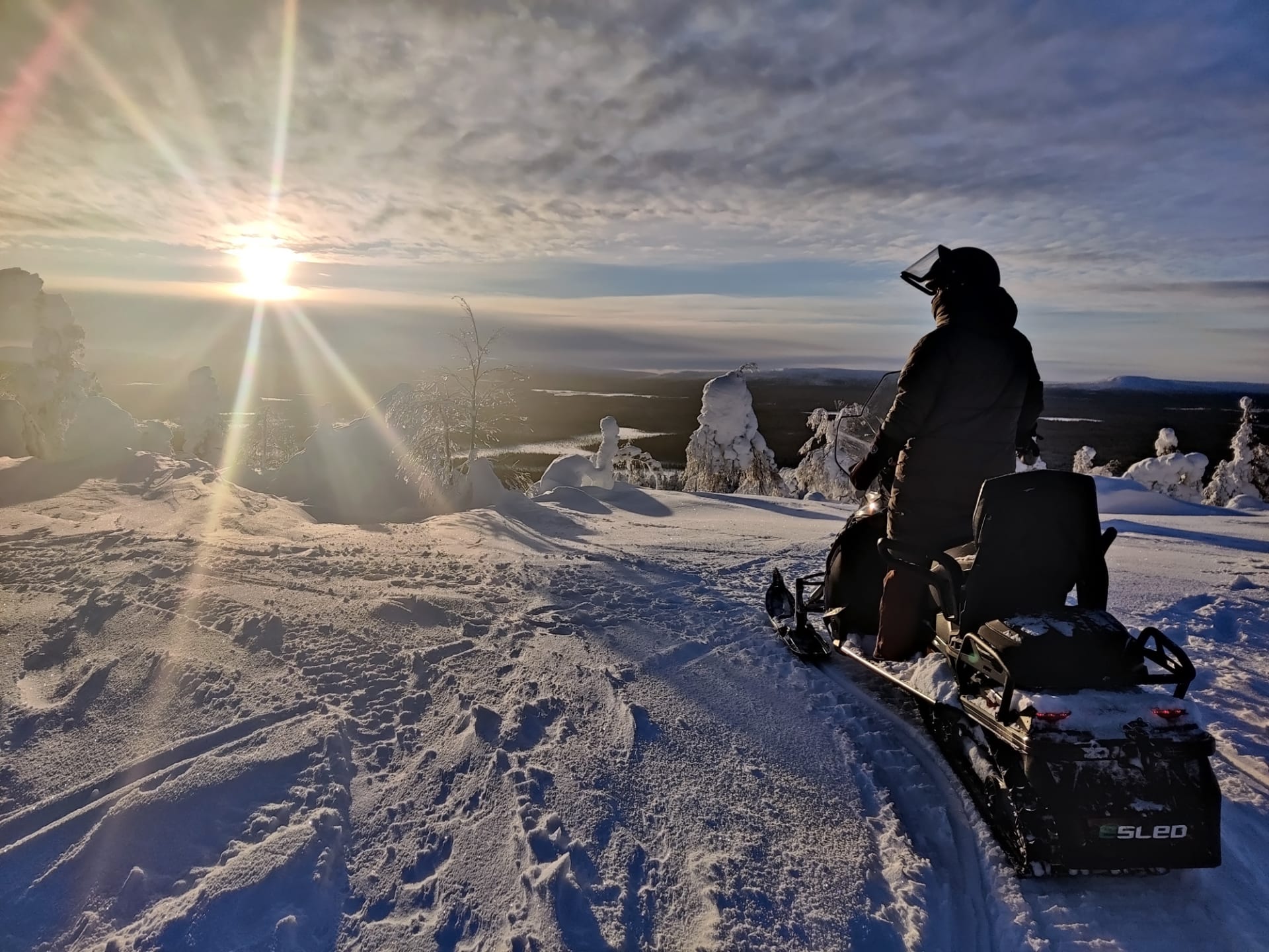 Admiring the fell views on an Electric Snowmobile Arctic Nature Safari at Pyhä-Luosto, Lapland, Finland