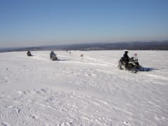 Icefishing safari by snowmobile
