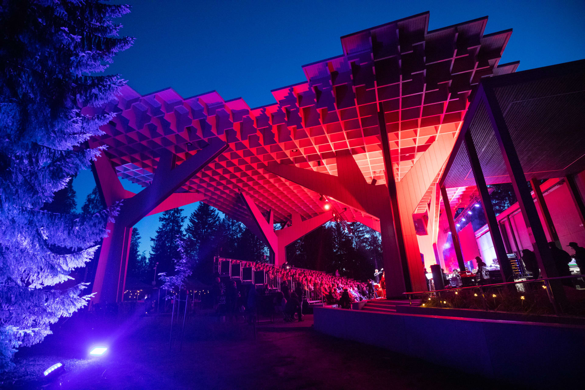 Hupisaaret Summer Teathre at night with pink spotlights