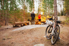 Campfire place and bikers at Sorola outdoor area