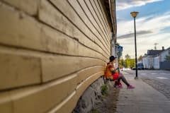 A person sitting next to the longest wall in Finland