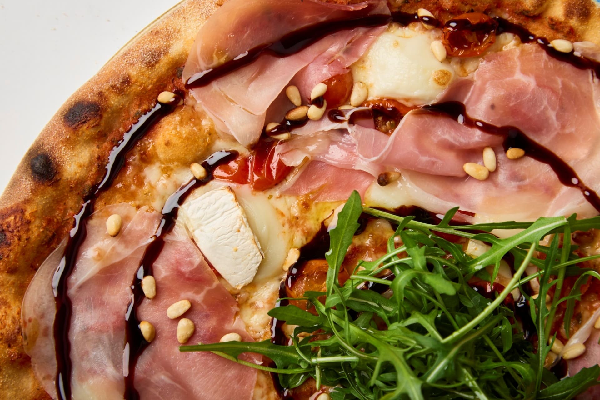 Goat'n Crudo With prosciutto, goat cheese, semi-dried tomatoes and balsamic syrup, Goat'n Crudo is like a summer's day treat in Tuscany — not heavy, but full of flavour.