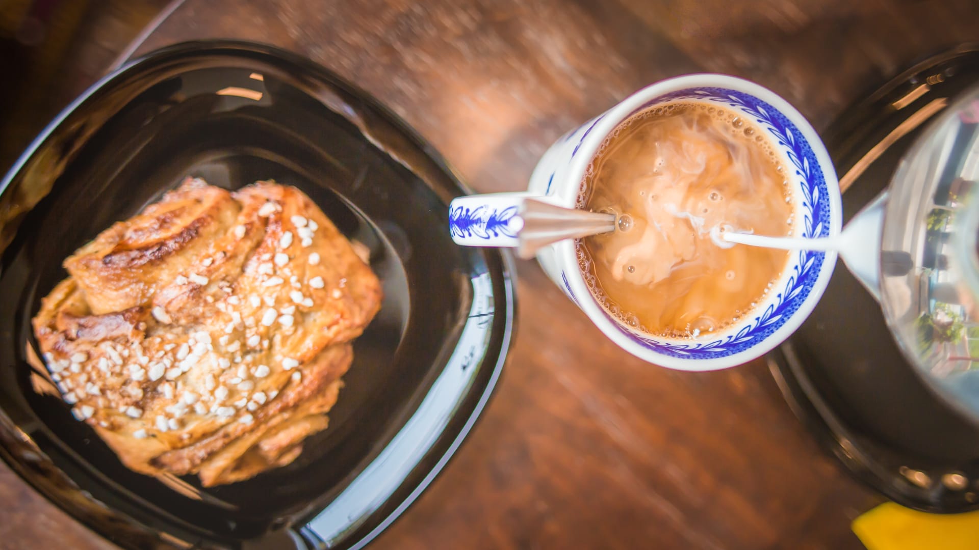 A hand baked Finnish cinnamon roll and a mug of coffee brewed in Finland at Bakery Cafe Puusti, Tampere, Finland