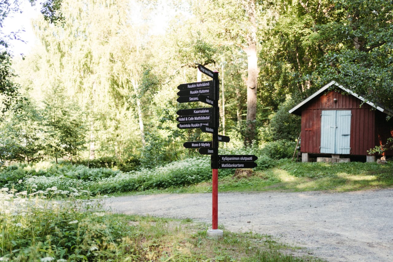Sign at the Mathildedal Iron Works and an old red fire equipment shed.
