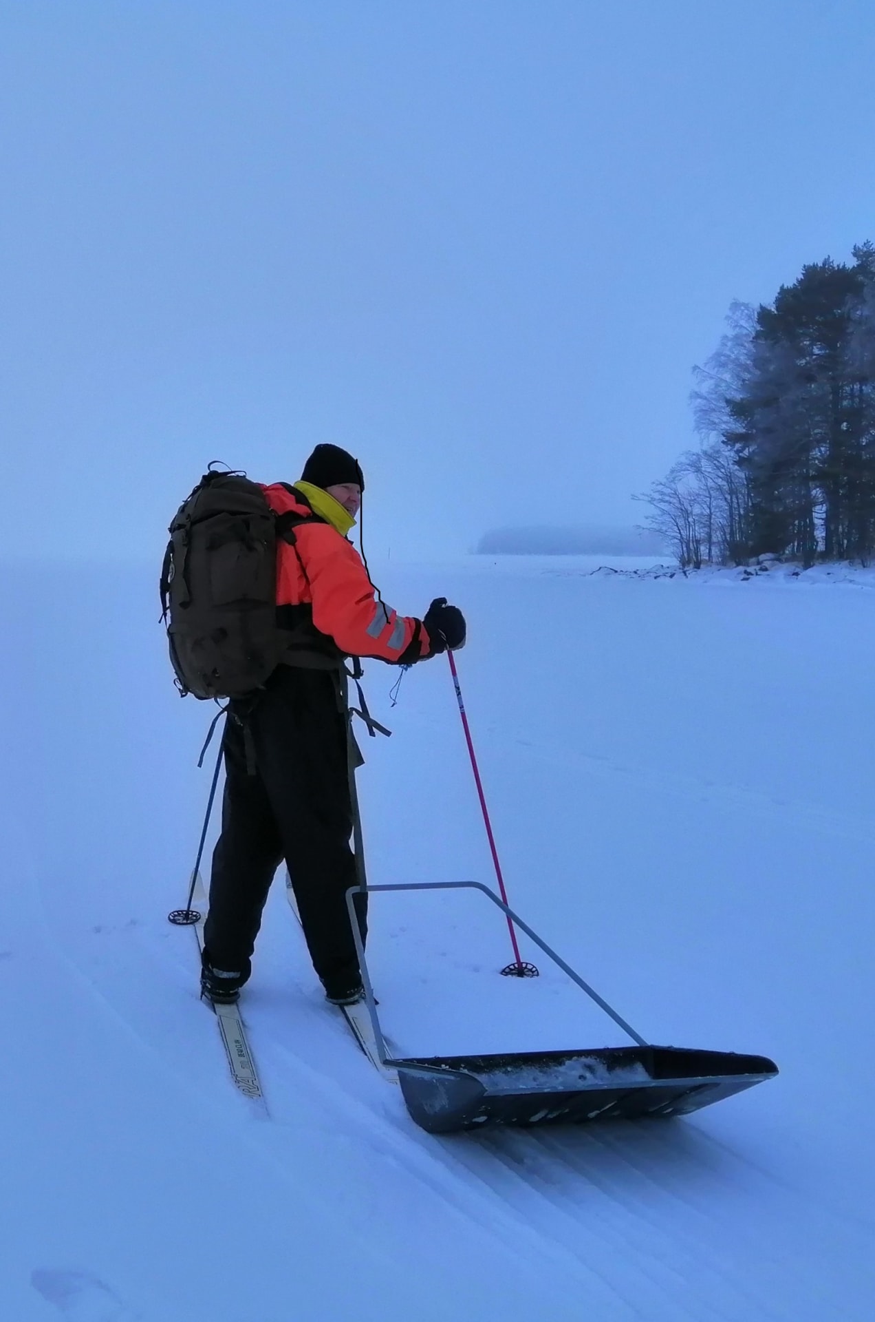 A man going to the frozen  Lake Saimaa