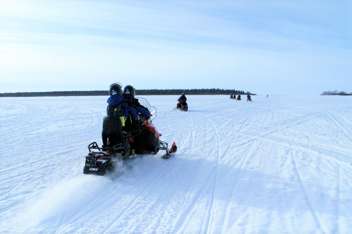 Ice Fishing Trip by Snowmobiles