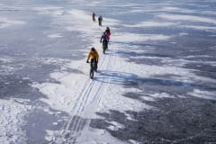 group cycling on the frozen sea