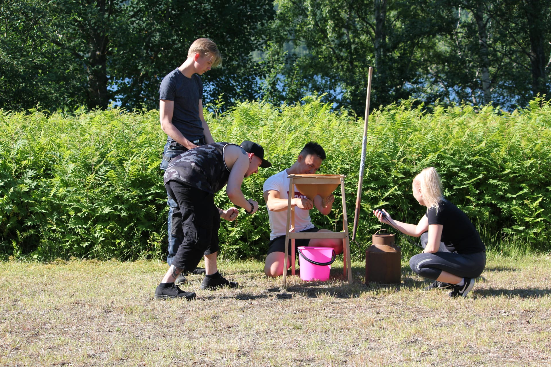 Team milking the cow during Farm Olympics