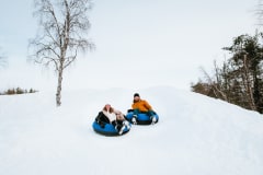 Snow tubing from the yard