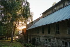 Sun setd behind an old carpentery shop.