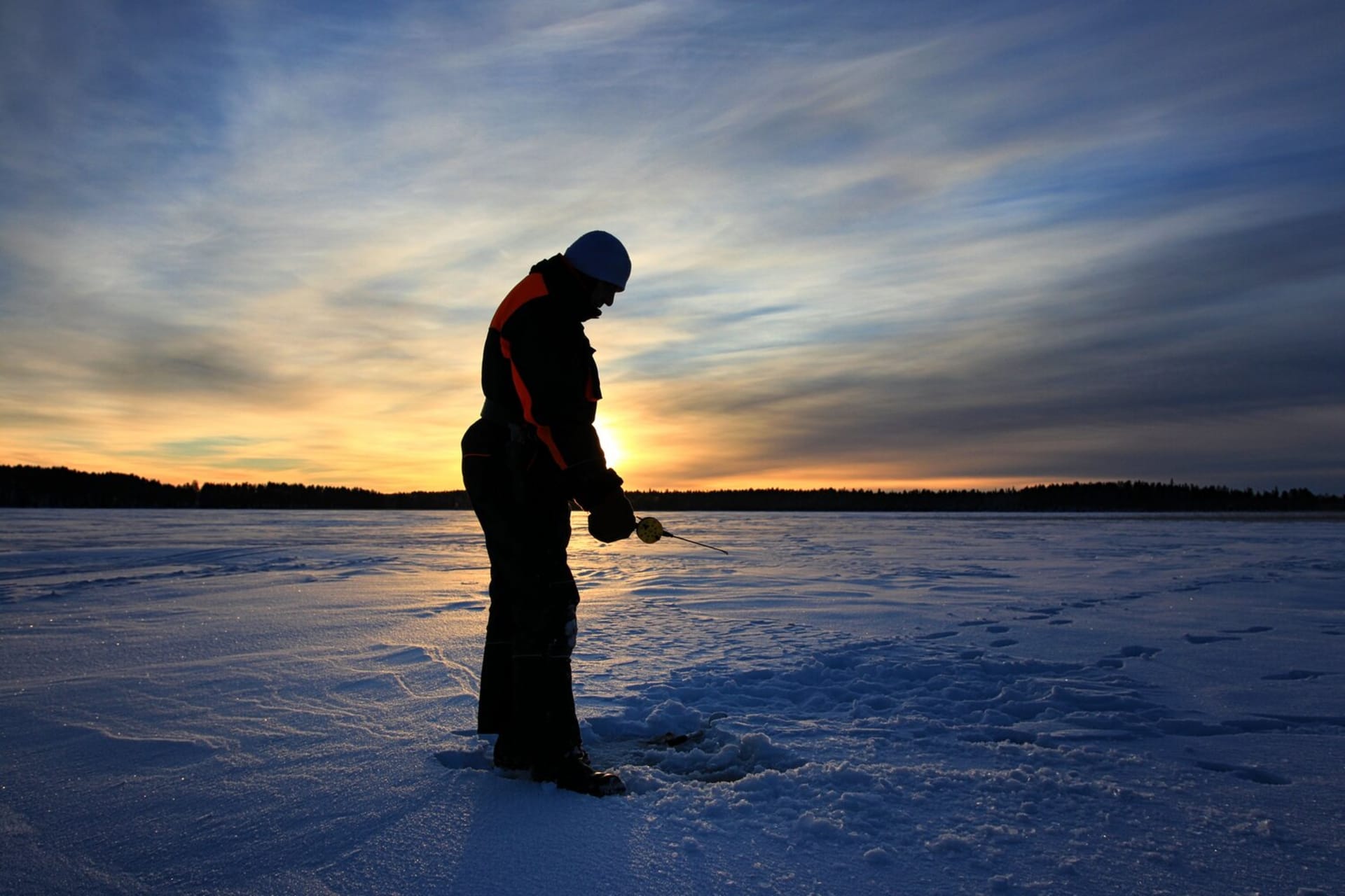 Mid winter sun and fisherman