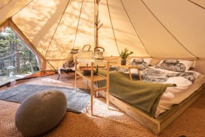 A cozy and comfortable stay in Scandinavian-style glamping accommodation.