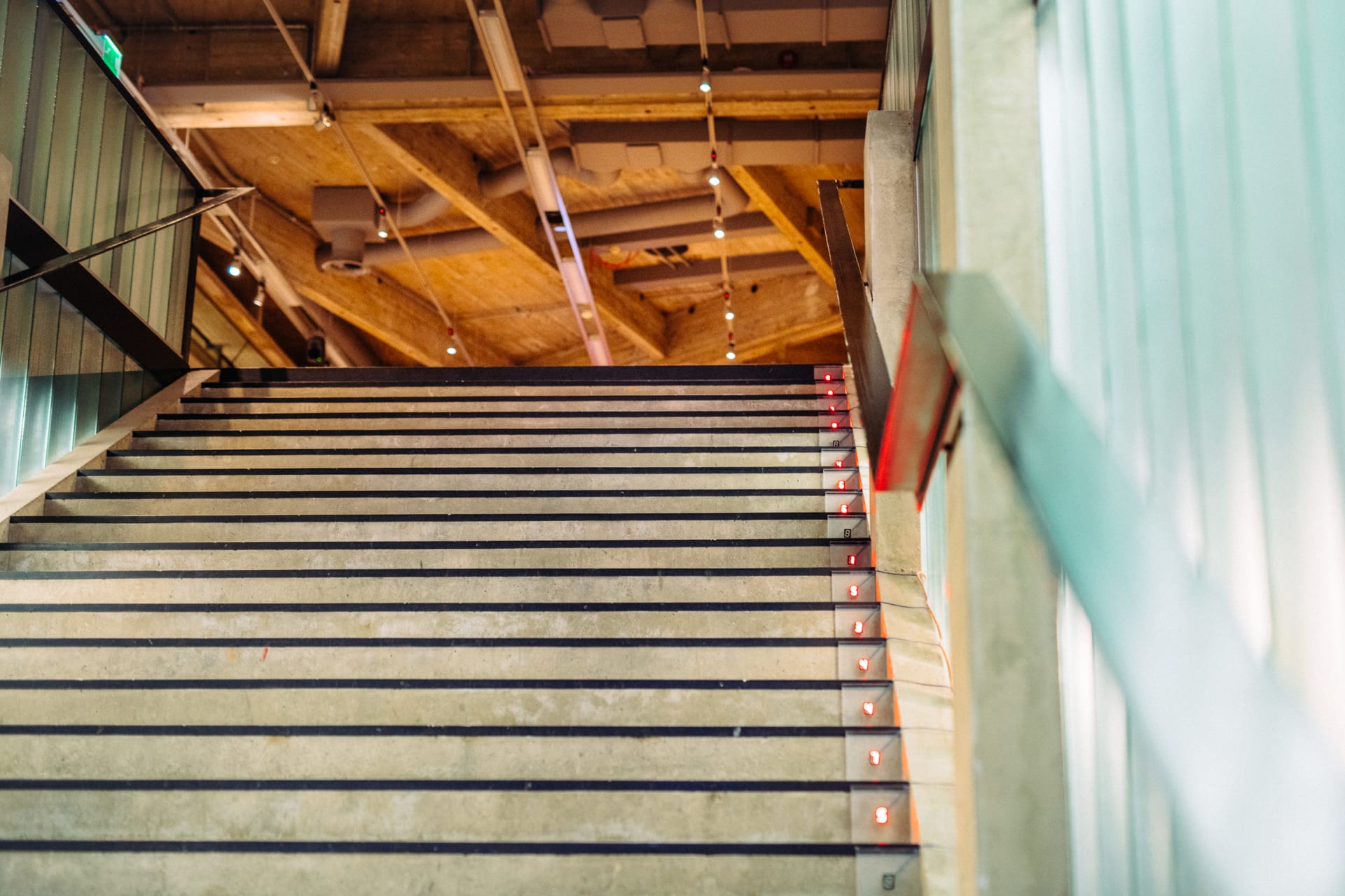 Staircase, leading from ground floor to 1st floor, showing  also a part of the inner roof structure.