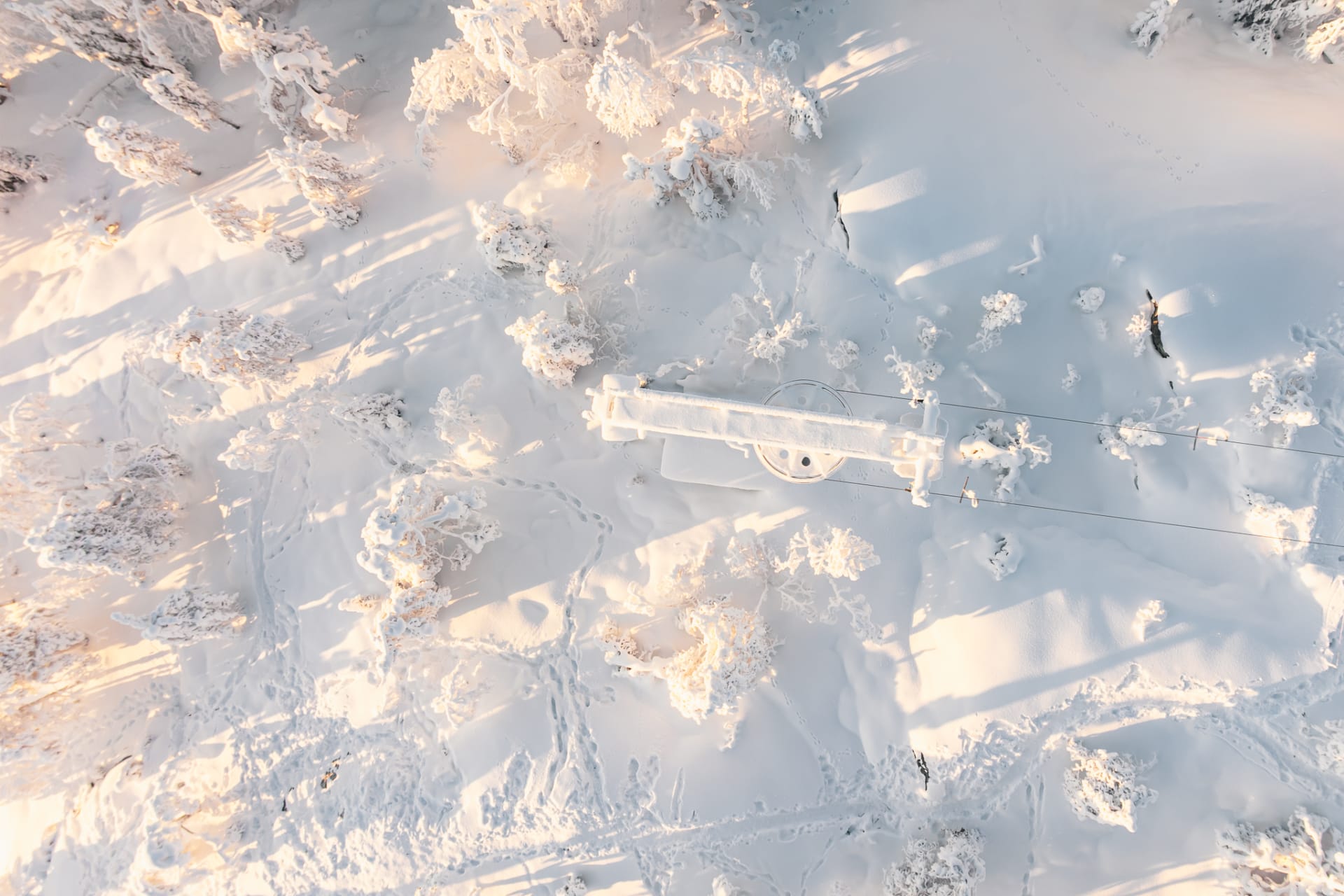 Footprints in the snow on the top of the hill
