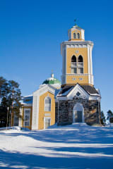 yellow church in winter sunlight