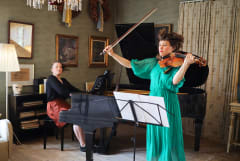 Pianist and viola player performing in Ainola
