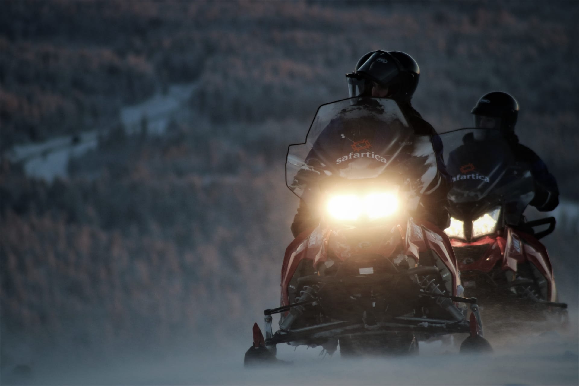 Snowmobiling in the evening