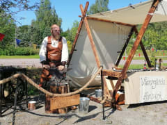 The blacksmith with his tent at a market