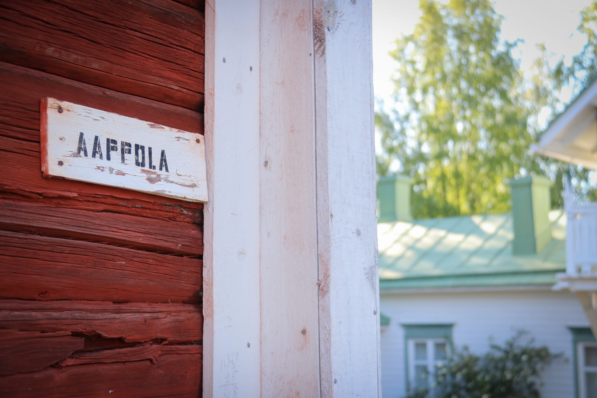 Building wall with a museum sign Aappola (Abraham Ojanperä Home Museum).