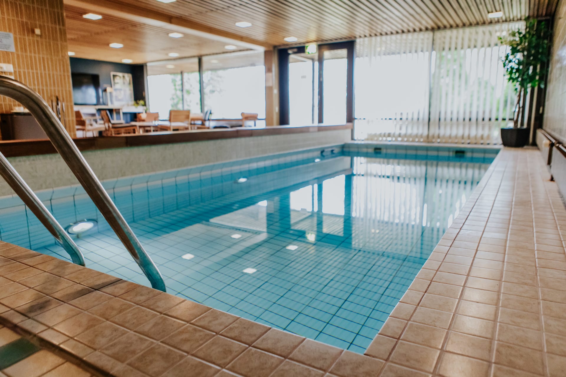 Pool Area of Hotel Fjalar. Sitting area of sauna department in the backround.
