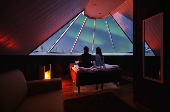 Aurora Cabin glass igloo under the Northern Lights in Apukka Resort Rovaniemi Lapland Finland