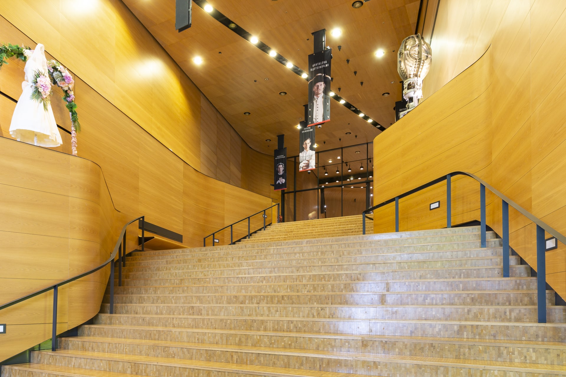 Long wooden staircase embraced with wooden walls and ceiling. 