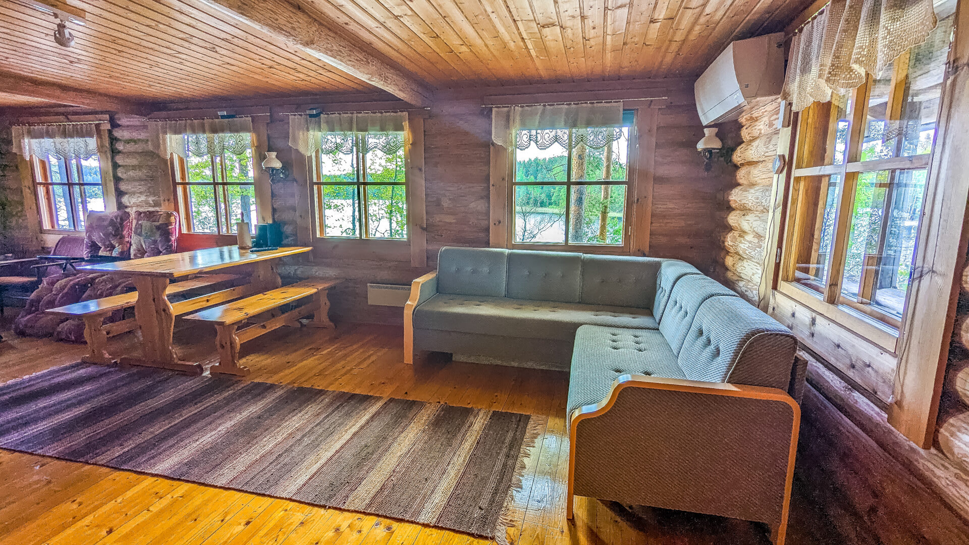 Spacious living room with sofa, dining table and smart tv
