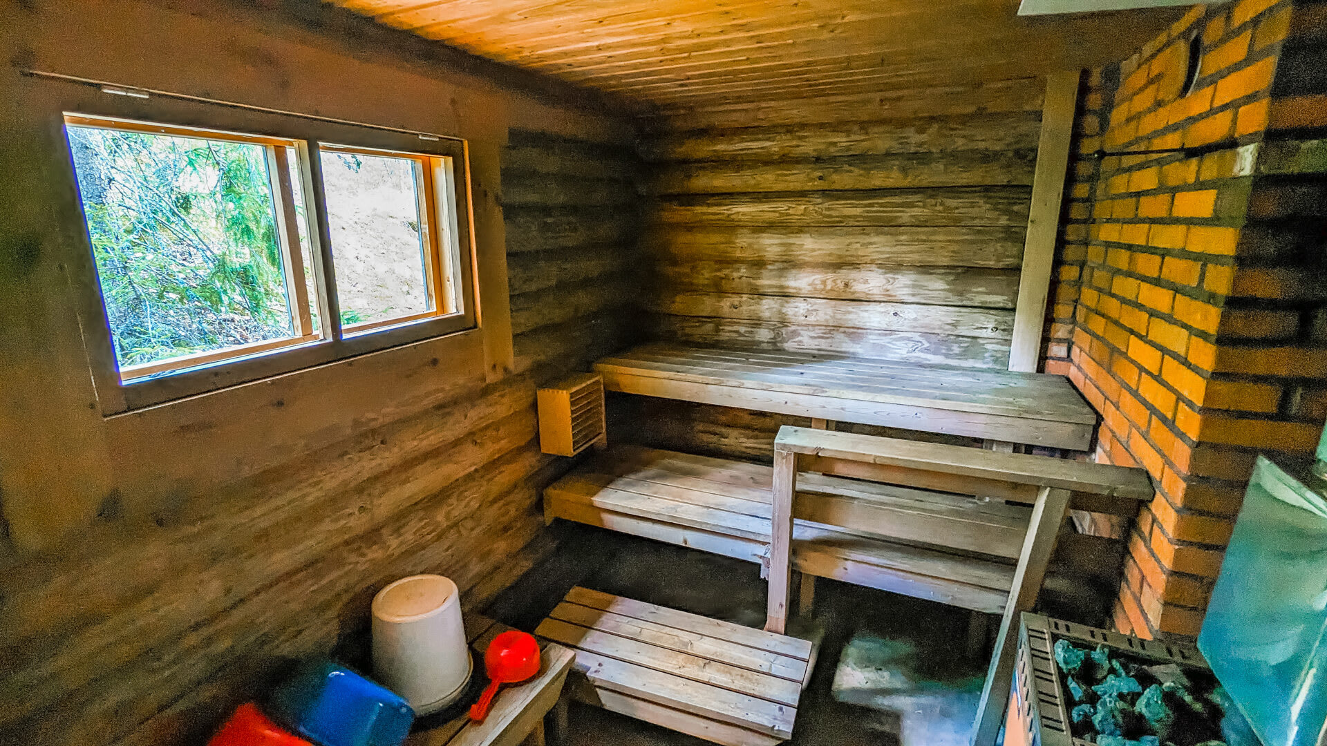 Sauna with wood-heaten sauna stove