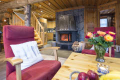 Atmospheric LeviDay 2 villa with livingroom and fireplace.