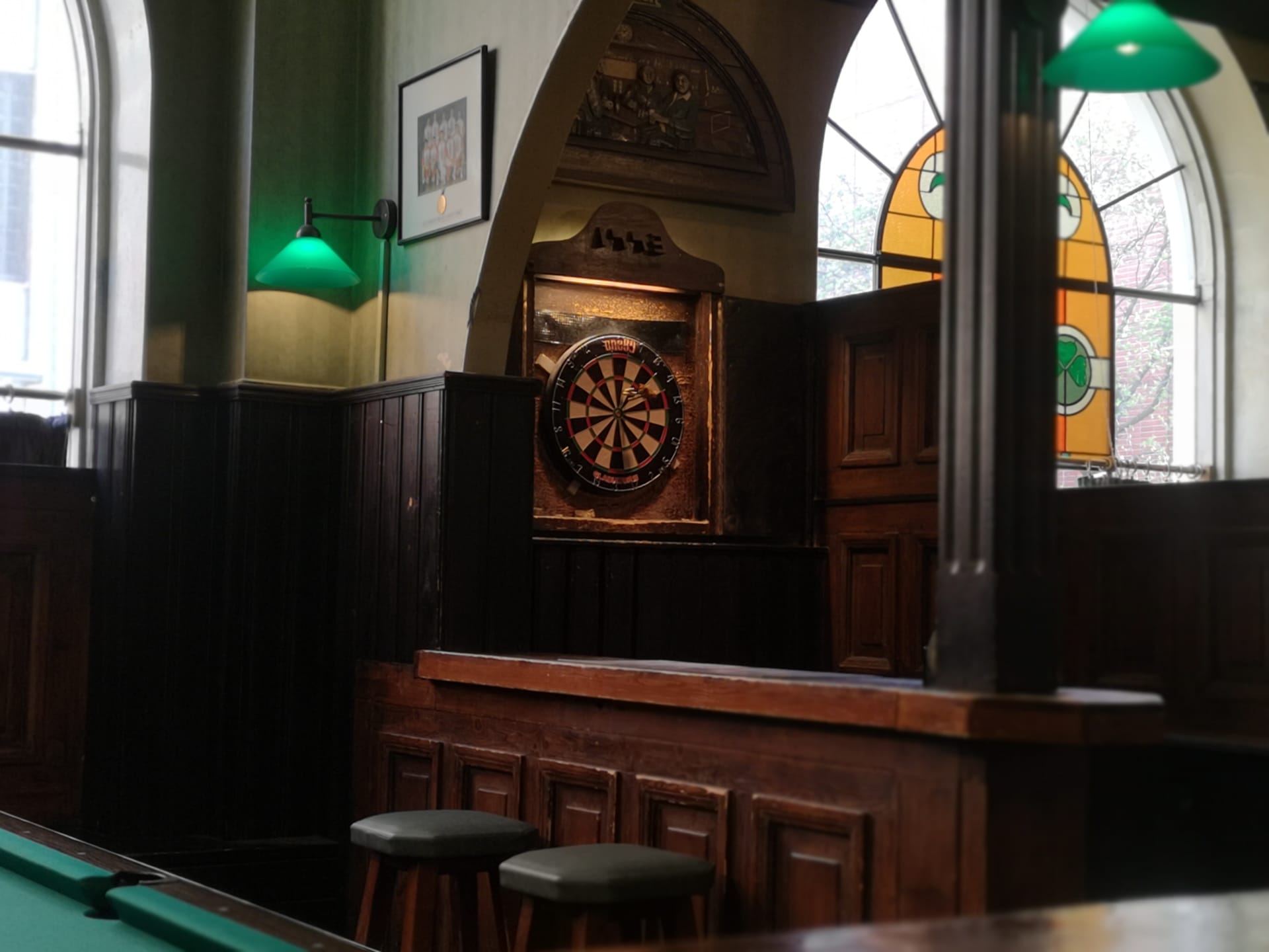 Challenge your friend to a round of darts or billiards.