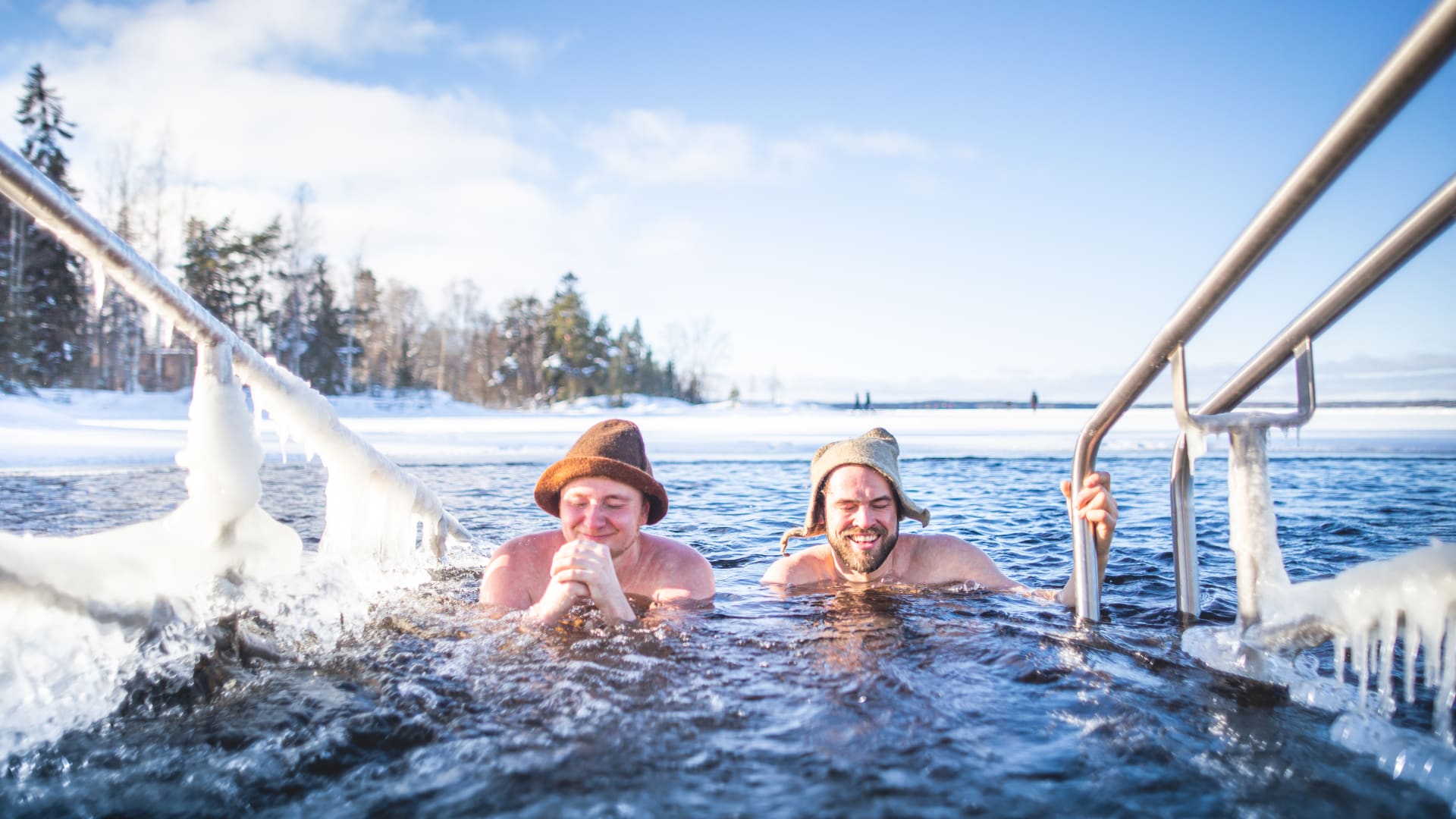 Matti and Juha winter swimming in Rauhaniemi.