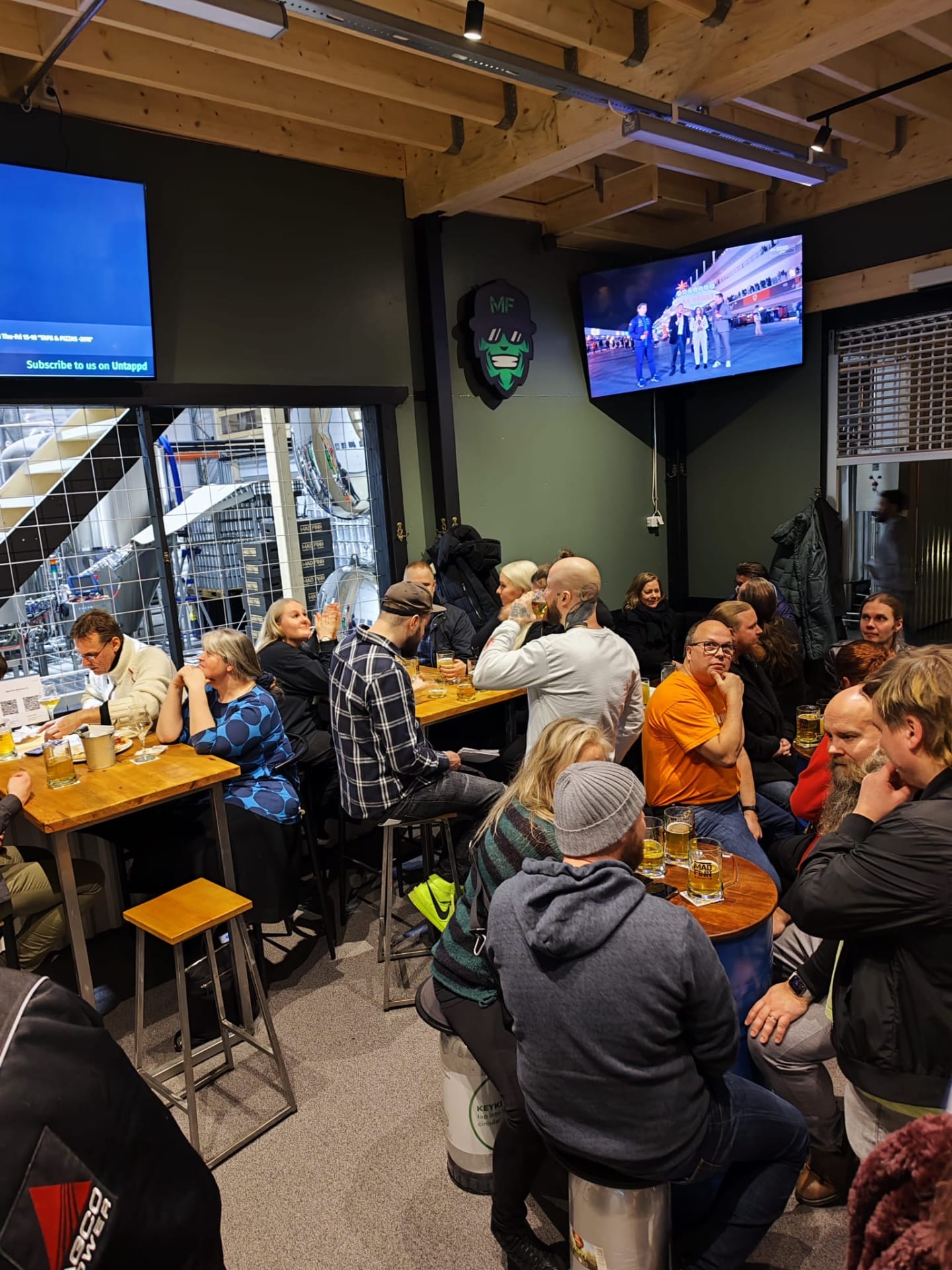 People sitting inside the taproom