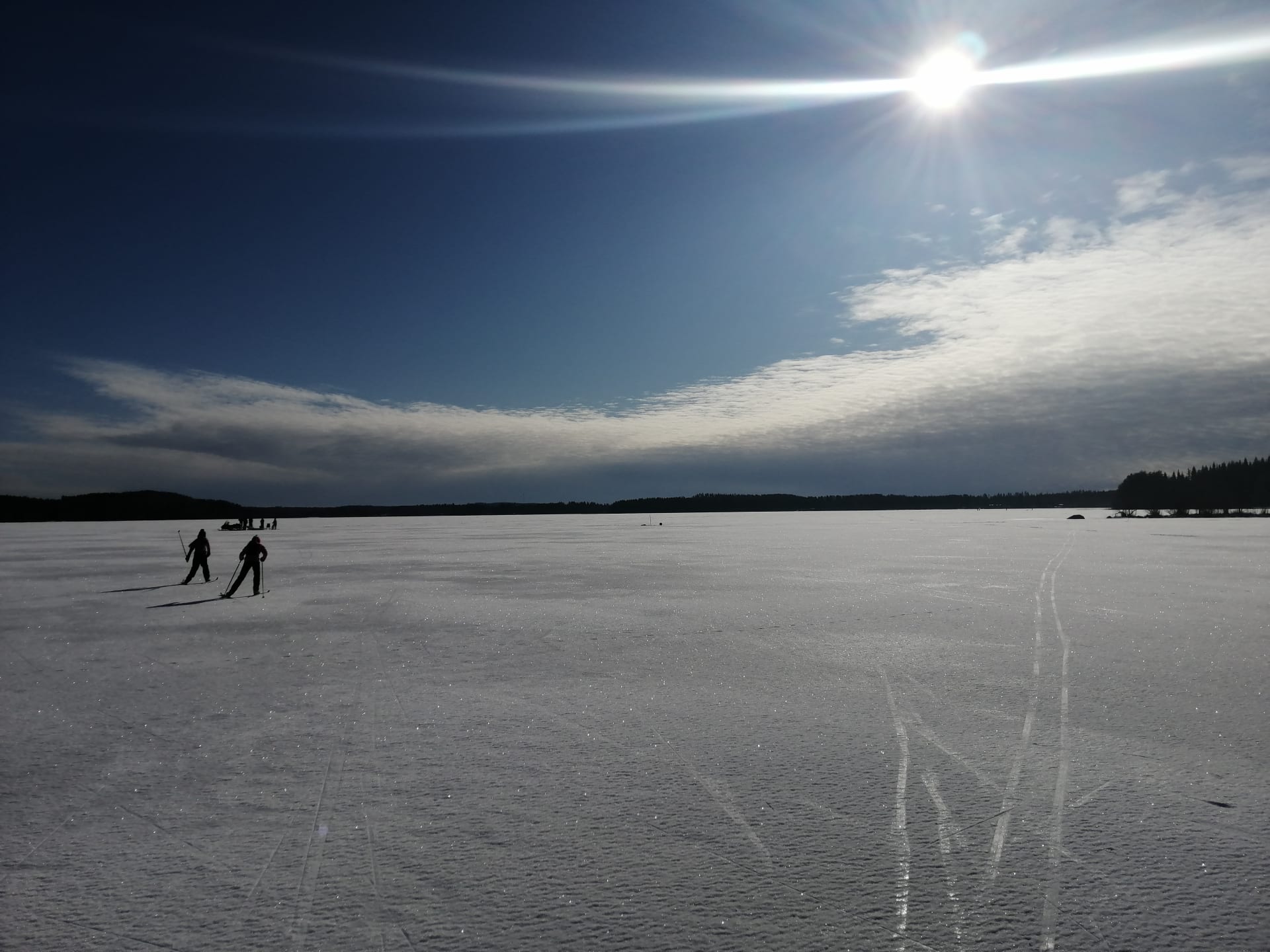Skiing and skating on the ice of the lake Puruvesi.