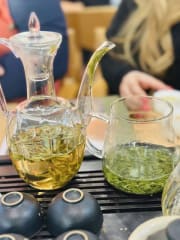 Chinese green tea and Japanese green tea in teapots