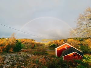 Rainbow and red houses