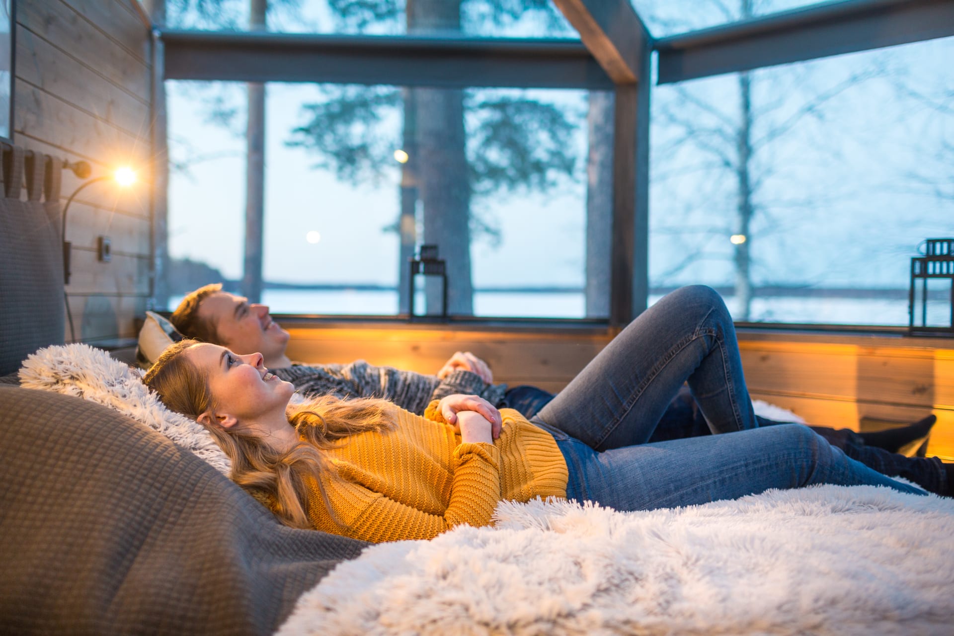 A couple in a Glass Cabin winter.