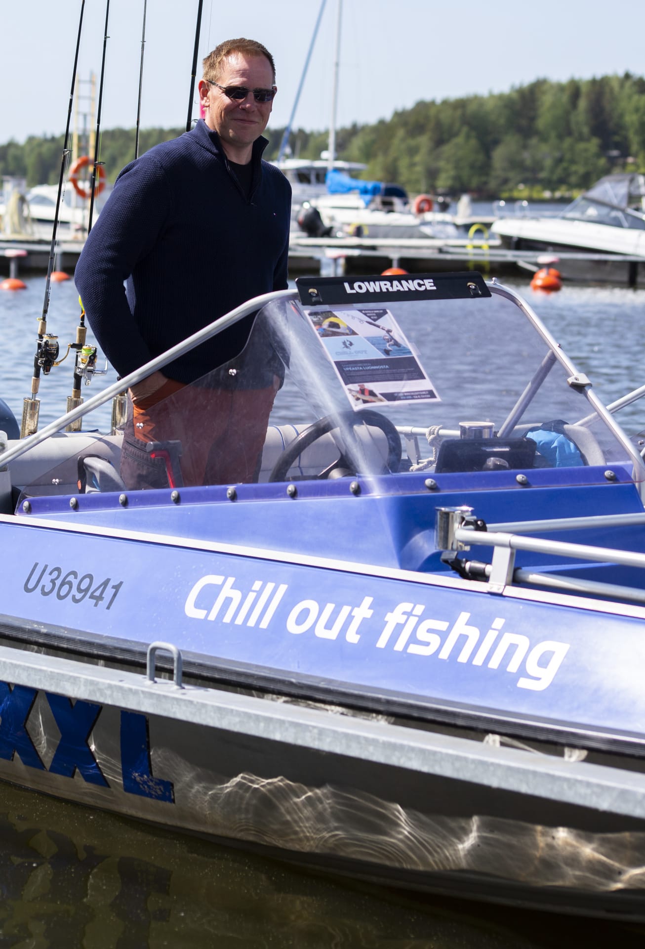 Boat driver standing inside his boat.