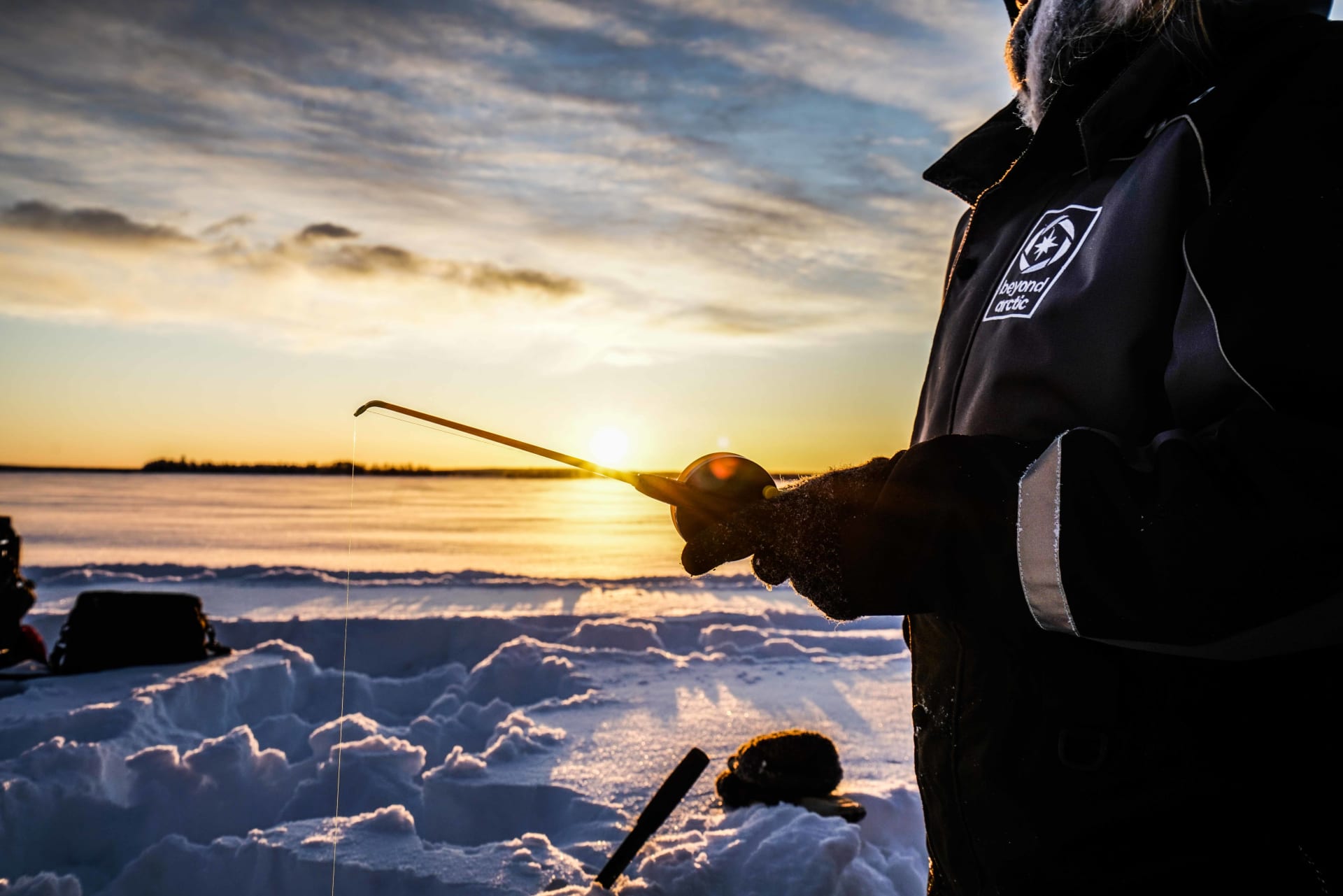 Ice fishing on a lake.