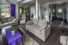 The living room, kitchen and dining area are open space. There is a fireplace in the living room.