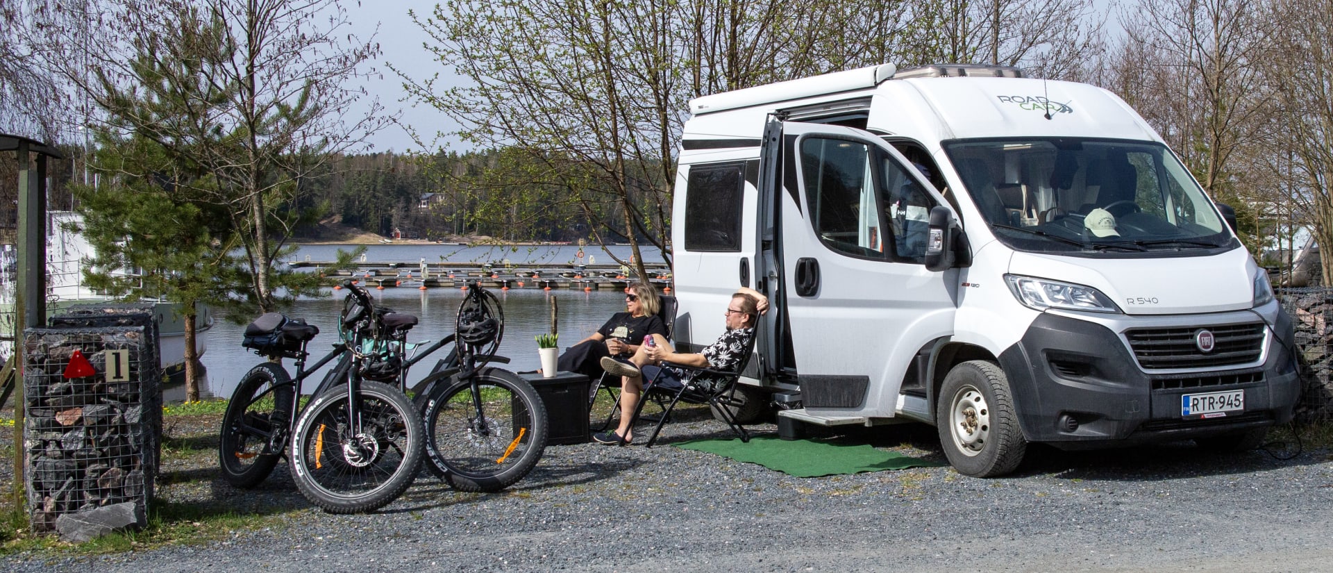 Travelers enjoying the spring sun at Mathildan Marina's caravan park.