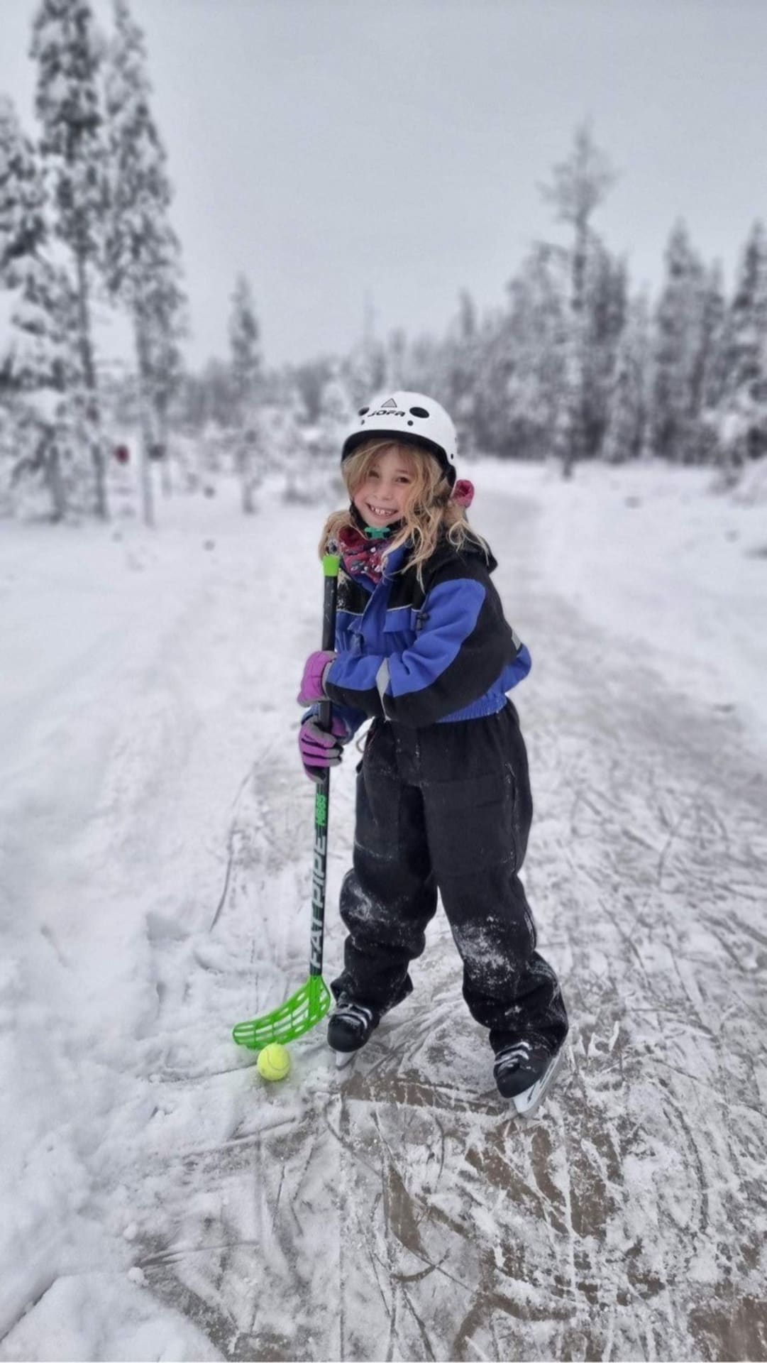 A girl playing ice ball in Kotatieva