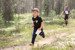 Young orienteer running in the terrain of Kainuu O Week