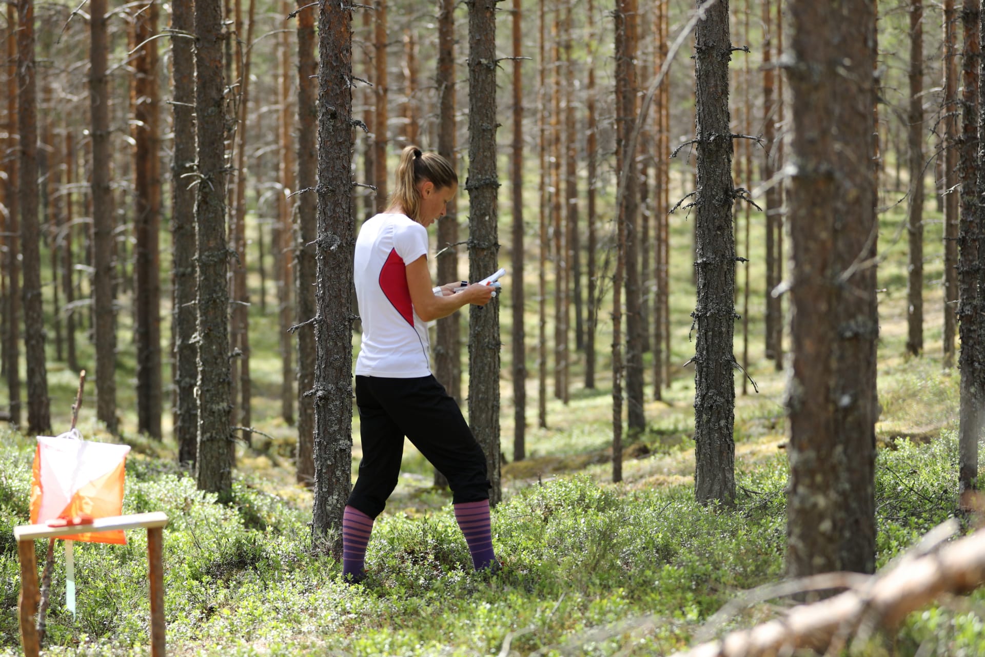 Orienteer heading for next control point in the terrain of Kainuu O Week