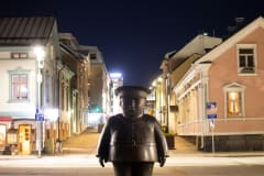 Policeman statue at night.